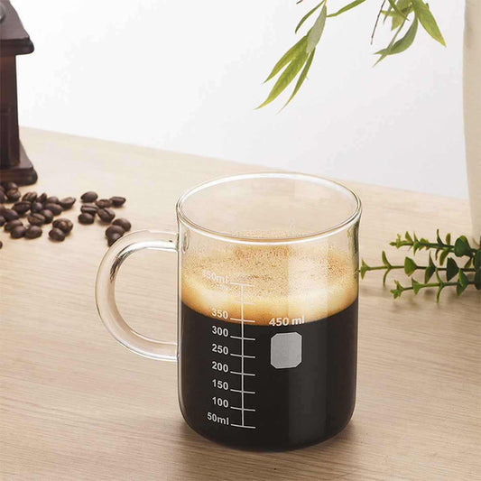 Clear borosilicate glass coffee cup with etched measurement markings and heat-resistant design for precise brewing