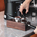 Solid wood barista station rack organizing tamper, portafilter, and coffee tools on kitchen counter