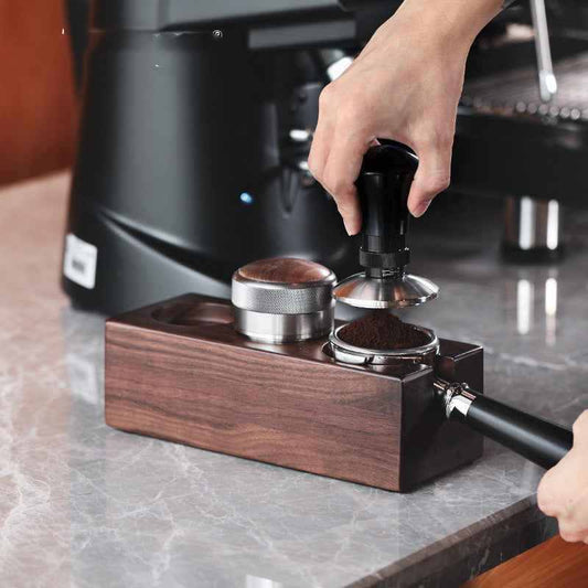 Solid wood barista station rack organizing tamper, portafilter, and coffee tools on kitchen counter