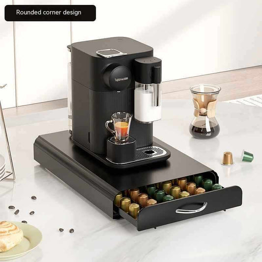 Sleek carbon steel coffee capsule drawer organiser holding Nespresso pods in a tidy kitchen counter space
