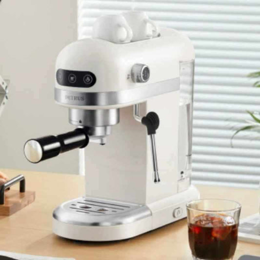 Compact white stainless steel espresso and milk frother machine for home barista setup